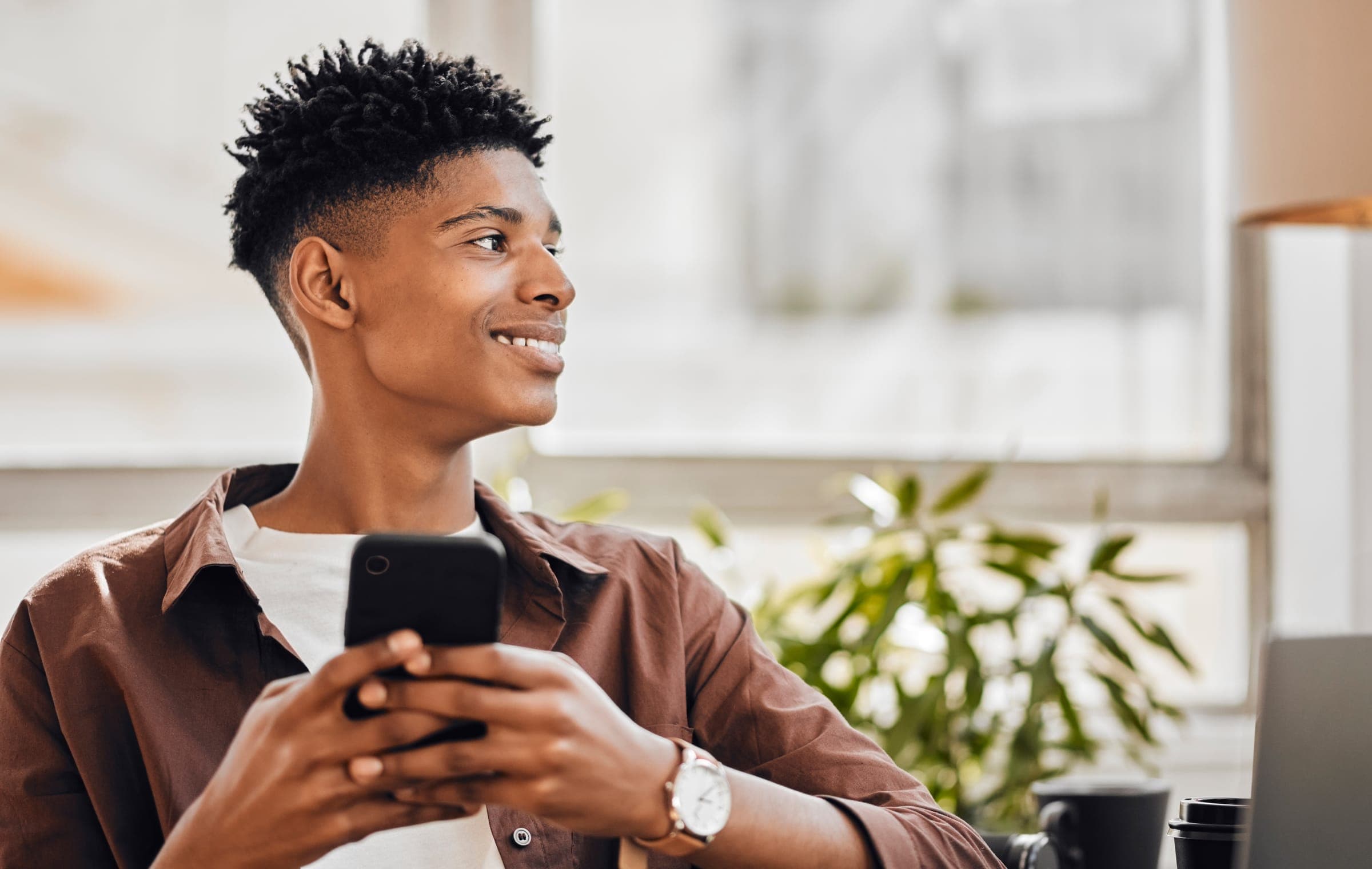 Teen with phone, looking forward